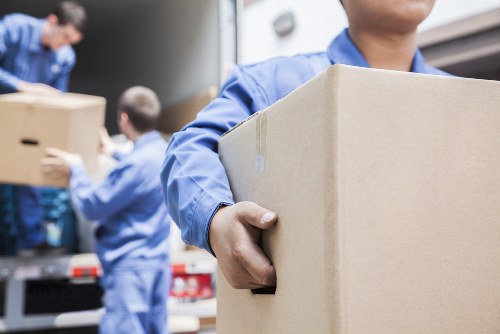 Removal van and movers ready for a same-day house move in Colliers Wood