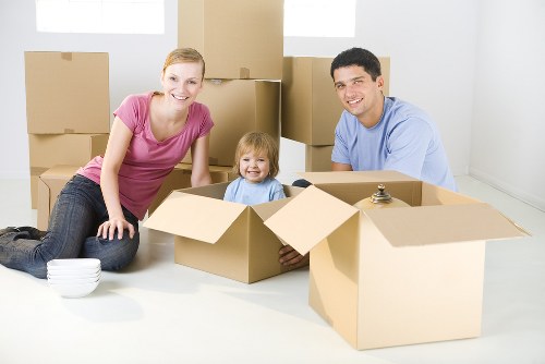 Packed moving boxes and furniture prepared for a quick local removal service