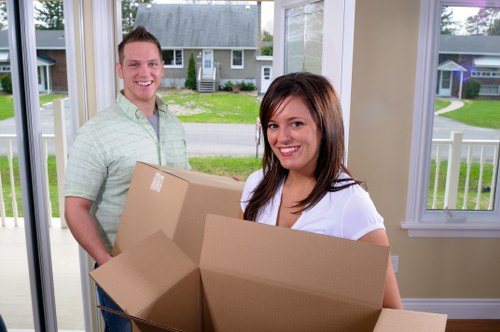 Transport team handling furniture and boxes during a move