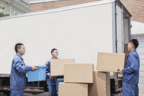 Student moving boxes and furniture being loaded for a local Colliers Wood removal