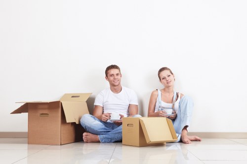 Local movers preparing fragile items for transport in Colliers Wood