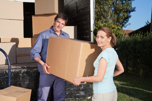 Trained movers assessing fragile items before loading the van